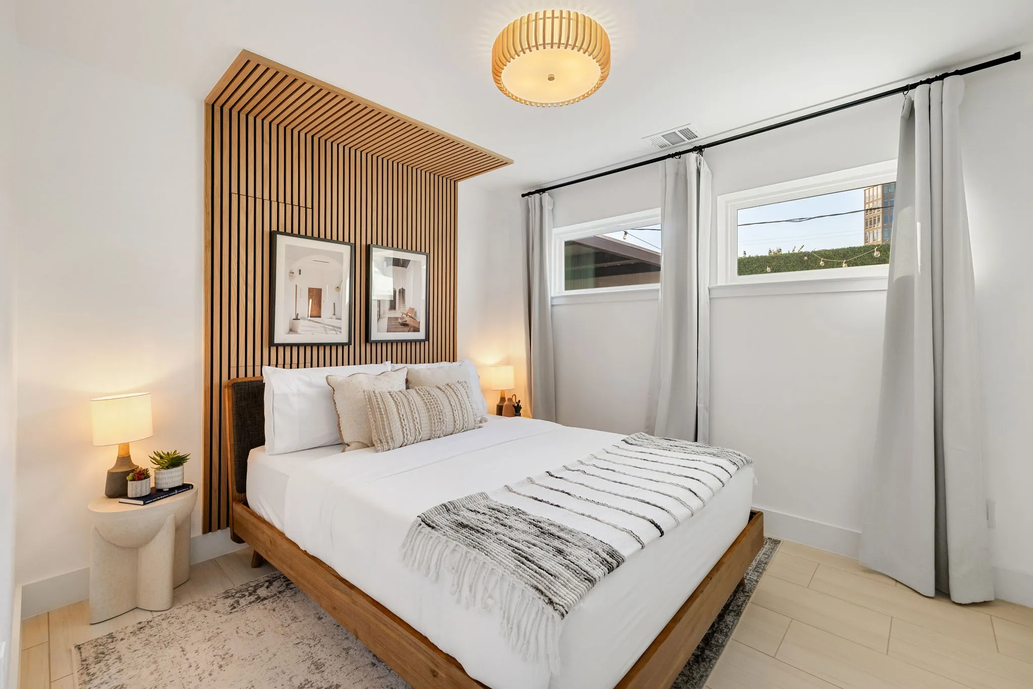 Ellum House junior bedroom with king bed and pool view patio